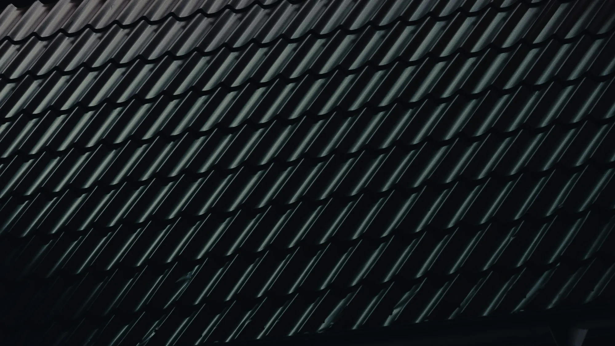 Glossy black roof tiles in diagonal lines